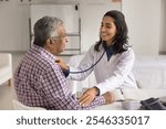 Latin cardiologist check heart rate of older male patient with stethoscope, monitoring heart rate conditions, to protect or manage age-related cardiovascular issues, coronary artery disease prevention