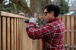 Latin Carpenter Man Screwing A Fence