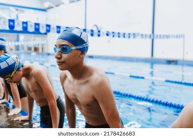 Latin Child Boy Swimmer Wearing Cap And Goggles In A Swimming Training At The Pool In Mexico Latin America