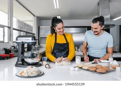 Latin Couple Bakers Preparing Dough For Baking Mexican Bread Called Conchas In Kitchen In Mexico City