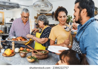 Latin family cooking turkey meat for thanksgiving dinner at home in Mexico Latin America, hispanic people eating at holidays - Powered by Shutterstock