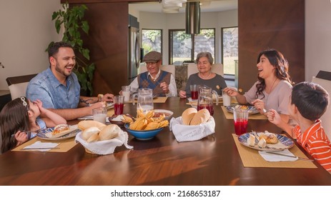 Latin Family Different Generations Enjoy Thanksgiving Food.