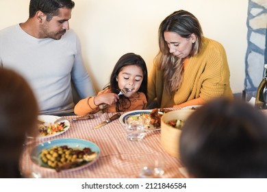 Latin Family Eating Lunch Together At Home On Patio