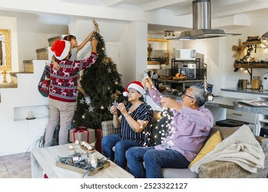 Latin Family parents and daughter with grandparents decorating christmas tree at home in mexico Latin America, hispanic people in holidays  - Powered by Shutterstock