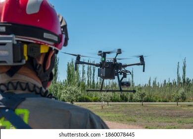 latin firefighter piloting rescue drone