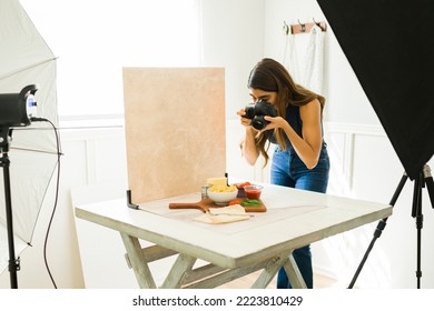 Latin Food Photographer Doing A Photo Shoot At Her Professional Studio With Good Lighting 