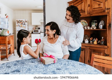 Latin Grandmother Woman With Daughter Or Grandchild Celebrating Birthday, 8 March International Women Holiday Or Happy Mother's Day In Mexico City