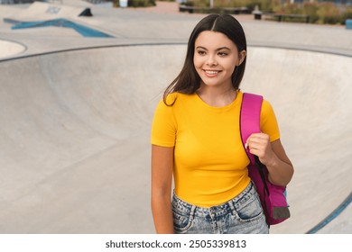 Latin hispanic positive high school pupil student teen girl teenager female skater in casual t-shirt with bag spend time weekend summer holidays in skate park after lessons looking aside copy space - Powered by Shutterstock