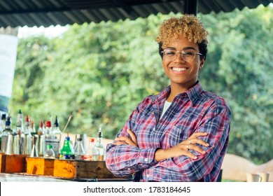 latin hispanic woman barmaid working at tropical hotel or restaurant - Powered by Shutterstock