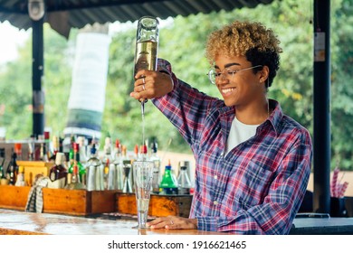 latin hispanic woman barmaid working at tropical hotel or restaurant