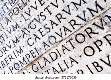 Latin inscription on Ara Pacis wall in Rome, Italy