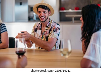 Latin Man With Beard And Hat Smiles Before Rolling The Dice