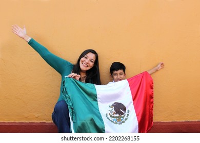 Latin Mexican Mom And Son Show The Flag Of Mexico Very Proud Of Their Culture And Tradition, To Celebrate The National Holidays Of Independence In September, Revolution Cinco De Mayo