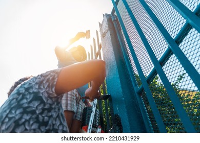 Latin Mother And Daughter From Central America Remodeling And Painting Their House