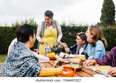 Latin Mother And Daughter Cooking Together Mexican Food At Home In Mexico City