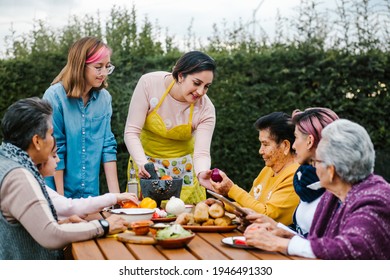 Latin Mother And Daughter Cooking Together Mexican Food At Home In Mexico City