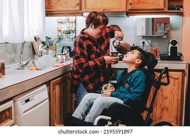 Latin mother taking care of son with disability on wheelchair inside home kitchen - Focus on child face - Powered by Shutterstock