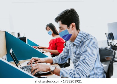 Latin People Working In Business Office Wearing Medical Face Mask For Social Distancing In New Normal Situation Protecting And Preventing The Infection Of Corona Virus Or Covid-19 In Latin America 