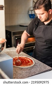 Latin Pizzeria Chef Cook Pizza In Professional Uniform. Restaurant Italian Cuisine Entrepreneur