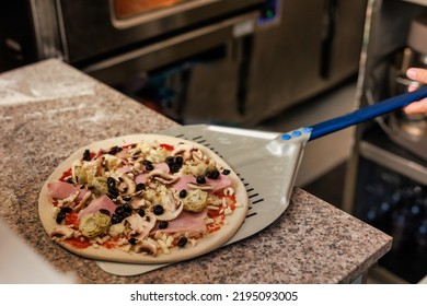 Latin Pizzeria Chef Cook Pizza In Professional Uniform. Restaurant Italian Cuisine Entrepreneur