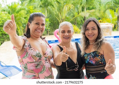 Latin Senior Women Friends Portrait At Swimming Pool