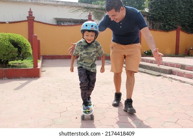 Latin single dad teaches his son to ride a skateboard with a helmet very funny and happy of the achievement of learning something new
 - Powered by Shutterstock