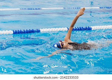 Latin Teen Girl Swimmer Athlete Wearing Cap And Goggles In A Swimming Training Holding On Starting Block In The Pool In Mexico Latin America