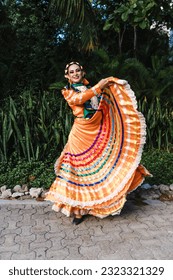 Latin woman dancer wearing traditional Mexican dress traditional from Guadalajara Jalisco Mexico Latin America, young hispanic female in independence day or cinco de mayo parade or cultural Festival - Shutterstock ID 2323321329