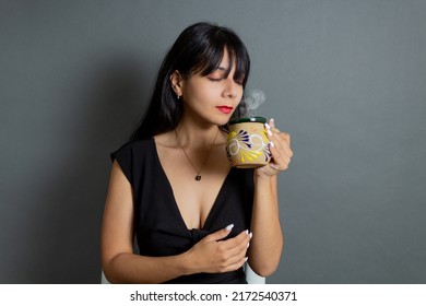 Latin Woman Drinking Mexican Coffee In Traditional Cup