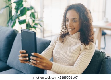 Latin Woman Facetime Or Video Conference On Tablet With Happy Feeling