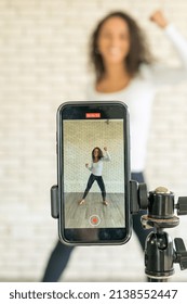 Latin Woman Influencer Created Her Dancing Video By Smartphone Camera. To Share Video To Social Media Application.