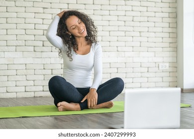 Latin woman influencer teaching yoga online - Powered by Shutterstock