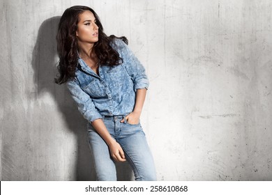 Latin woman in jeans and a denim shirt