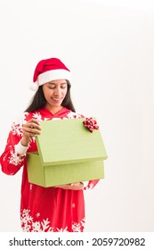 Latin Woman Open A Christmas Gift Box. Ugly Sweater Present Celebrating Xmas