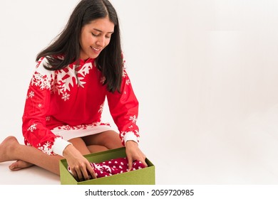 Latin Woman Open A Christmas Gift Box. Ugly Sweater Present Celebrating Xmas