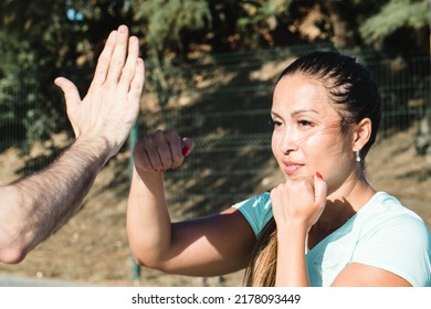 Latin Woman In A Self Defense Class. Fighting Women's Glass Ceiling Concept