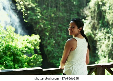 
Latin woman smiling in natural viewpoint, girl on adventure trip