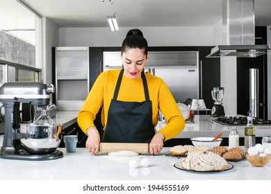 Latin Woman Standing In Kitchen And Kneading Dough To Bake Conchas Traditional Mexican Bread