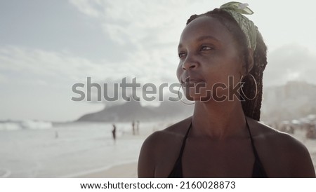 Latin young girl in a famous beach in "Rio de Janeiro", Brazil. Summer vacation holiday.