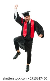 Latin Young Man Wearing A Graduation Gown. Male Graduate Dancing And Celebrating His Academic Success After Getting A College Degree