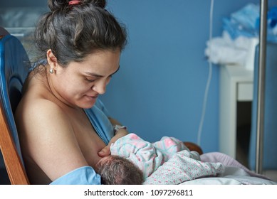 Latina Mom Breast Feeding Newborn Baby In Private Hospital