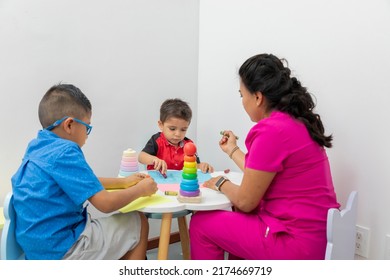 Latina Pediatrician Doctor Playing Two Children Stock Photo 2174669719 ...