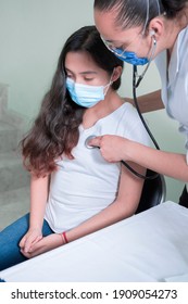 Latina Woman Doctor Makes Medical Check-up Listens To Heart And Lungs Of Latina Teenager In General Check-up