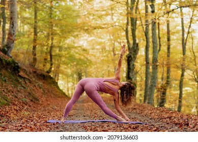 Latina Woman Practicing Yoga In The Forest.