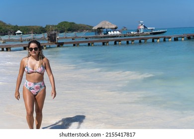 Latina Woman Walking On The Beach