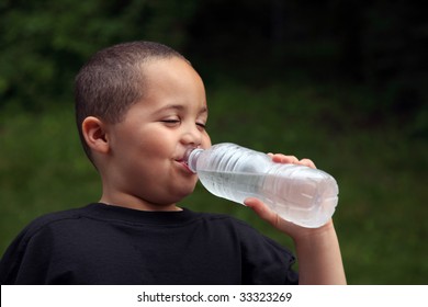 Latino Boy Drinking Water From Bottle