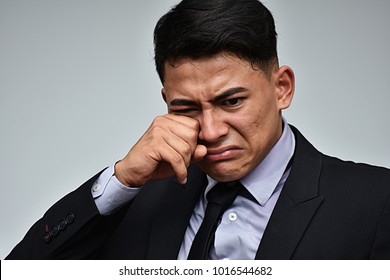 Latino Business Man Crying Wearing Suit And Tie