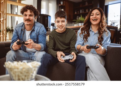 Latino family playing video games with their controllers. - Powered by Shutterstock