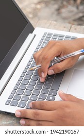 Latino Hands Using A Computer. Brown Fingers Typing A Laptop. Laptop Keyboard Being Used By Latin Hands. Vertical Imagen