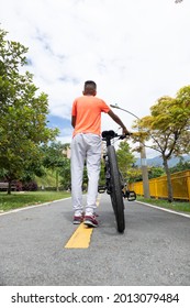 Latino Hispanic Teen On A Mountain Bike